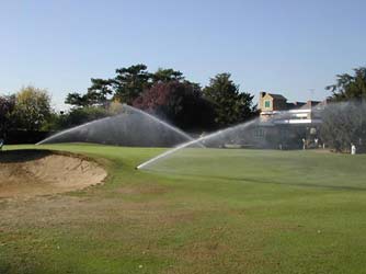 Golf course being watered with Sprinklers / Rotos.