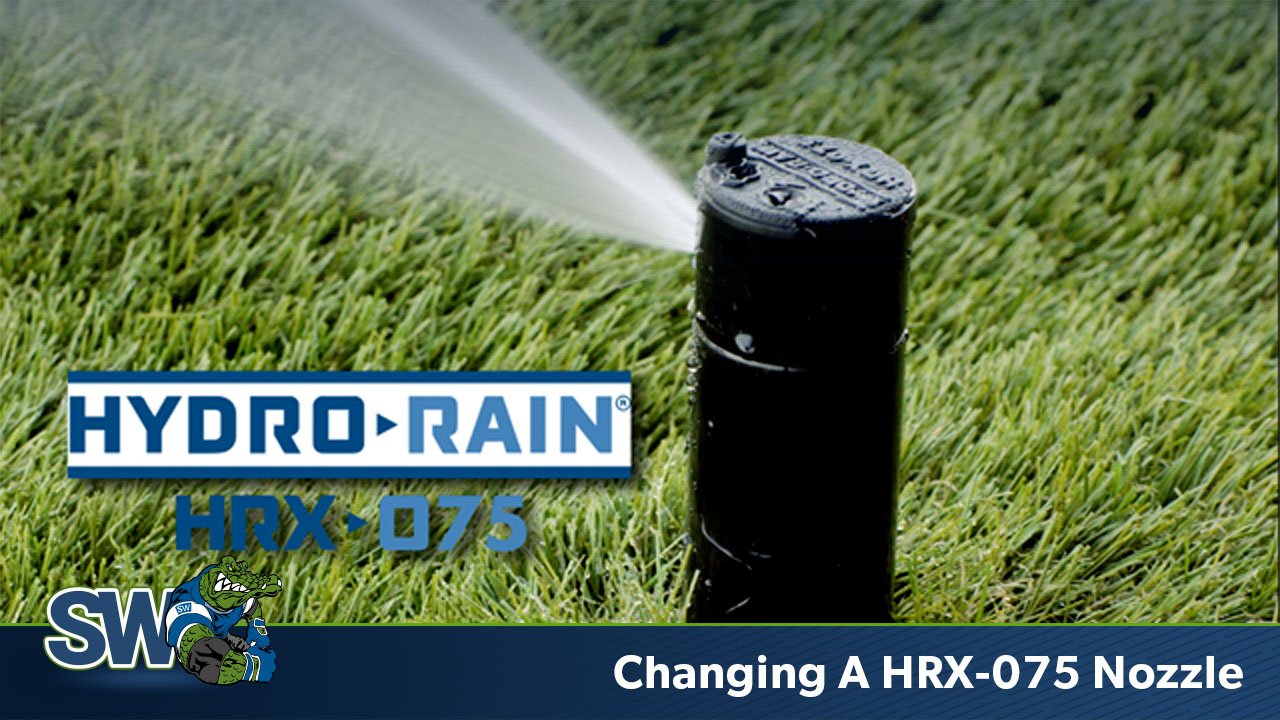 This picture has the Hydro-Rain HRX-075 nozzle spraying water on the grass and text for the product name and video title. There is a Sprinkler Warehouse logo in the corner with an alligator.