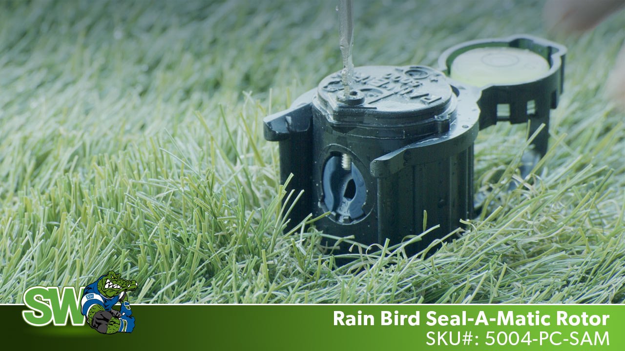 This is a picture of a Rain Bird 5004-pc-sam rotor spraying water in the grass.