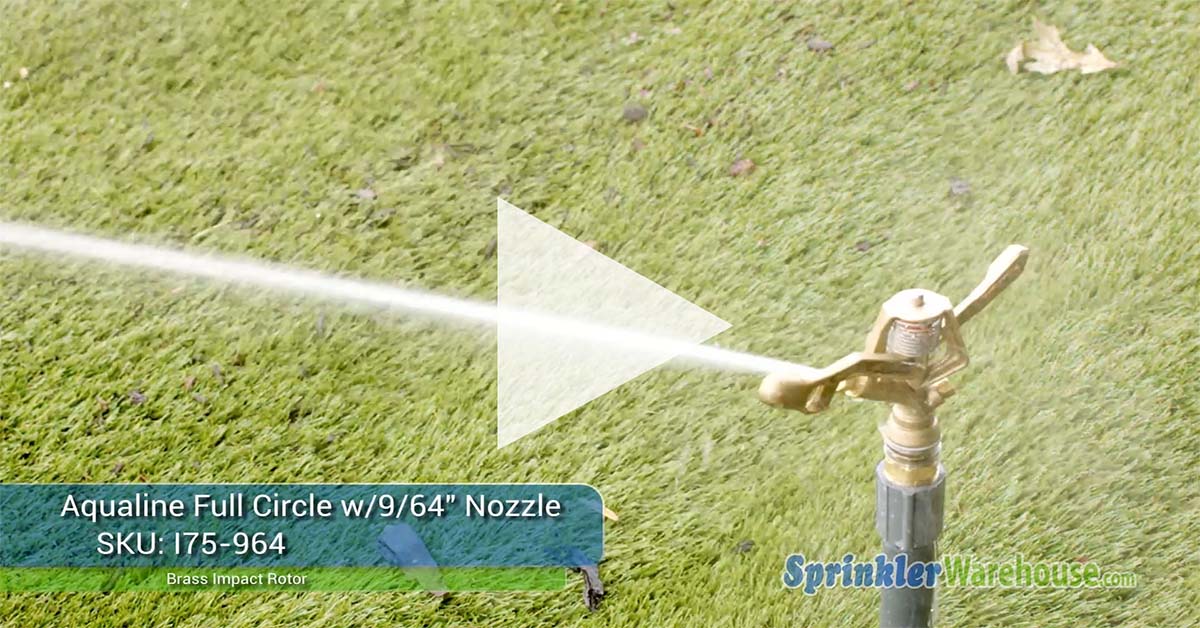 This image shows a brass impact rotor spraying water on the lawn to keep it healthy and green.