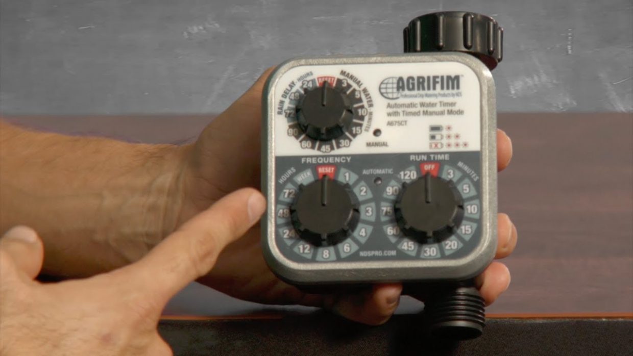 This is a demonstration picture showing how to operate the Agrifim hose end timer.