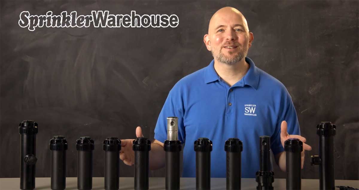This is the video thumbnail showing Dwayne Smith, the Sprinkler Warehouse Pro in a blue polo shirt with a variety of Rain Bird Rotors.