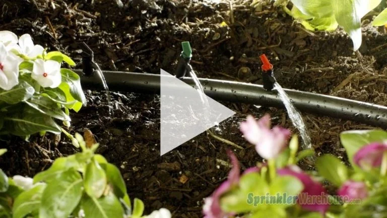Tutorials Install & Design 16 The image is demonstrating an irrigation drip line with three flag drip emitters.