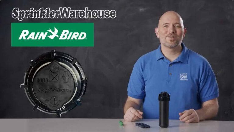 Tutorials Install & Design 6 Dwayne Smith sitting behind a counter with a Rain Bird 5004 rotor, a set of nozzles, and a green adjustment screw.