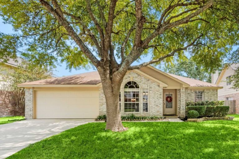 Tutorials Install & Design 5 Front of modest home with a large tree in the yard on a sunny picturesque day.